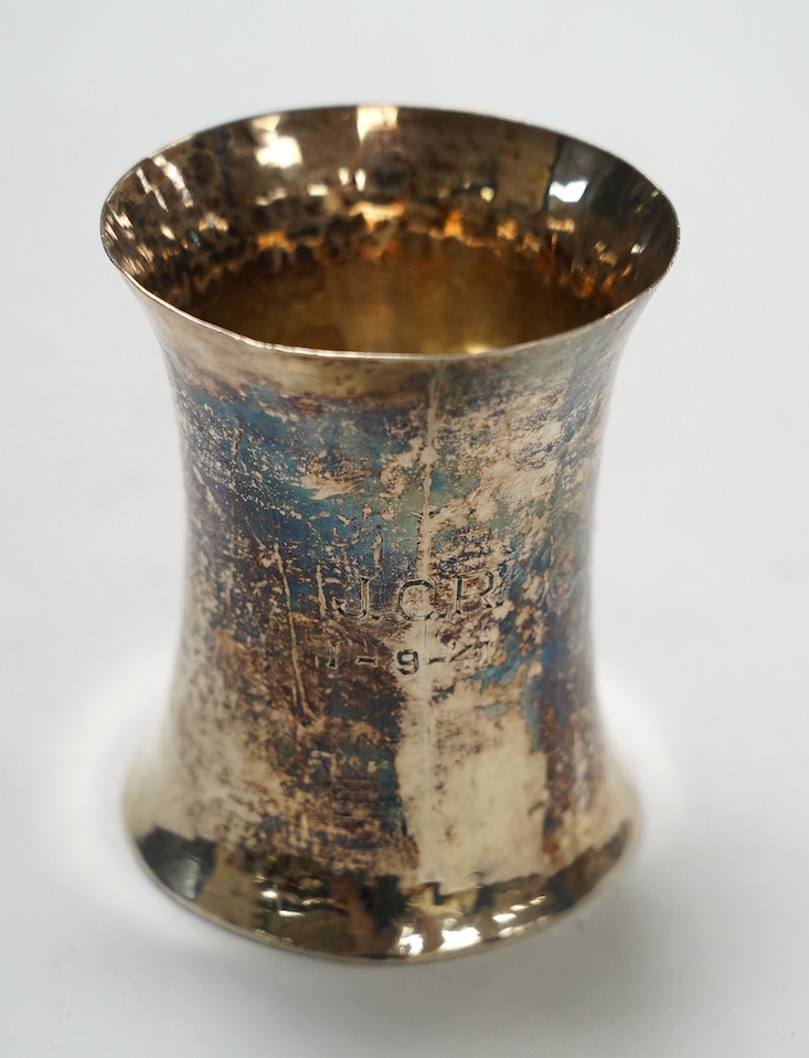 An Elizabeth II Irish planished silver beaker, William Egan & Sons, of waisted form, Dublin, 1964, 88mm, 5oz. Condition - fair.
